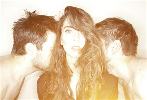 Woman with two guys surrounding her