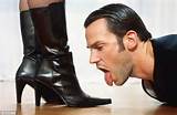 Man licking boots