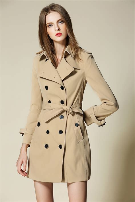 woman in trench coat; dominant
